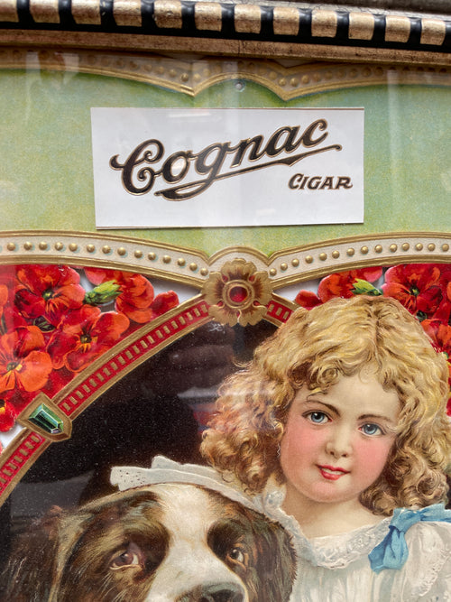 Circa 1900 Original Cognac Cigar Antique Advertising die cut sign depicting a Victorian Girl with Dog. Excellent condition in an ornate frame!
